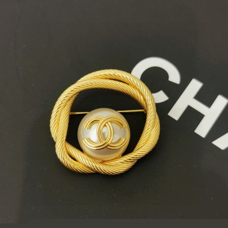 Ch*el brooches